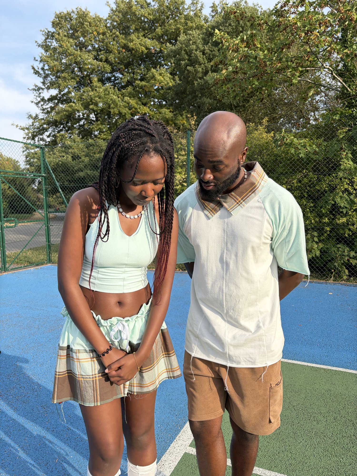 obi and Kah'Nya standing close, laughing