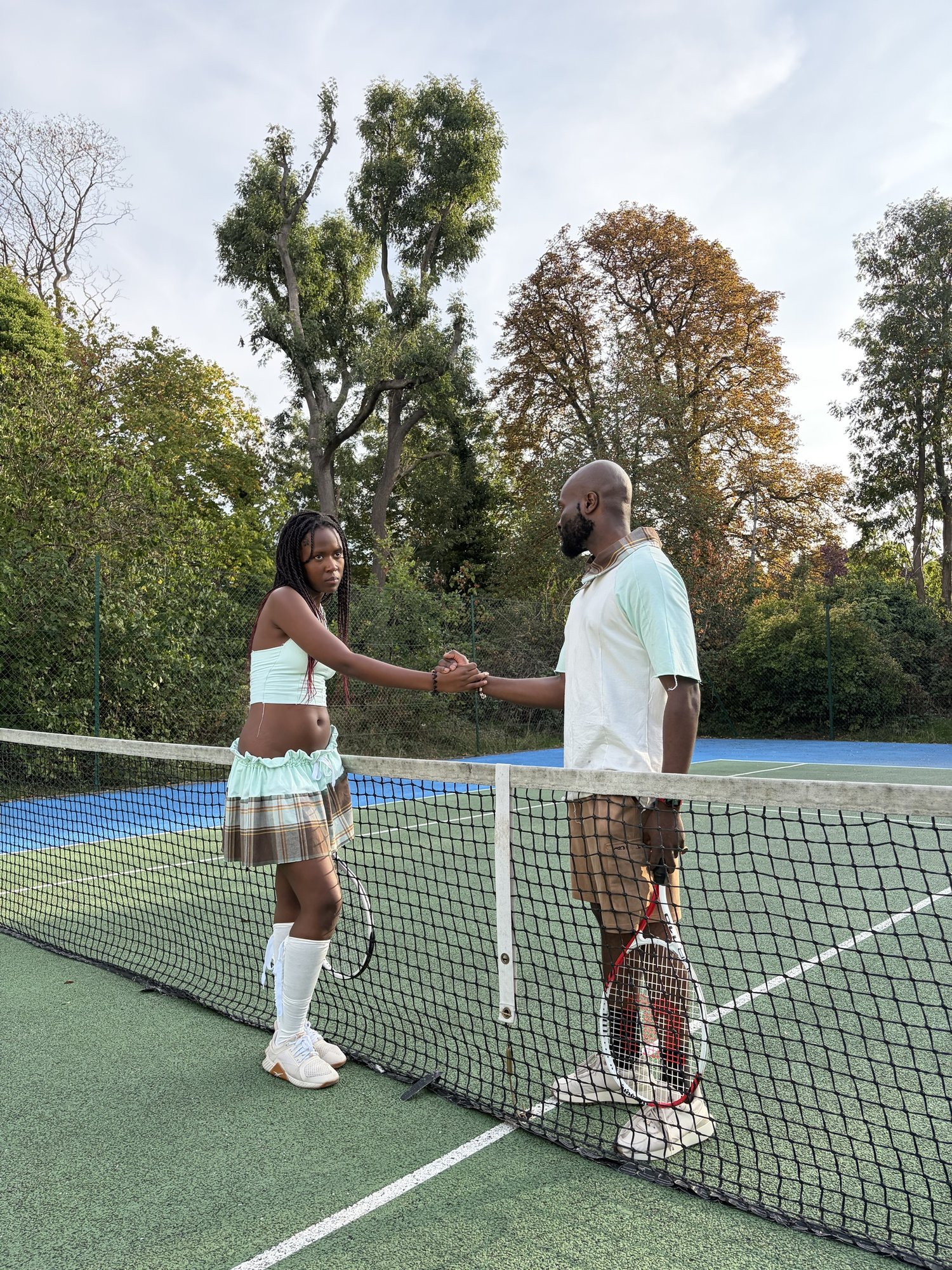 obi shaking hands over the net at The LightWave Grandslam
