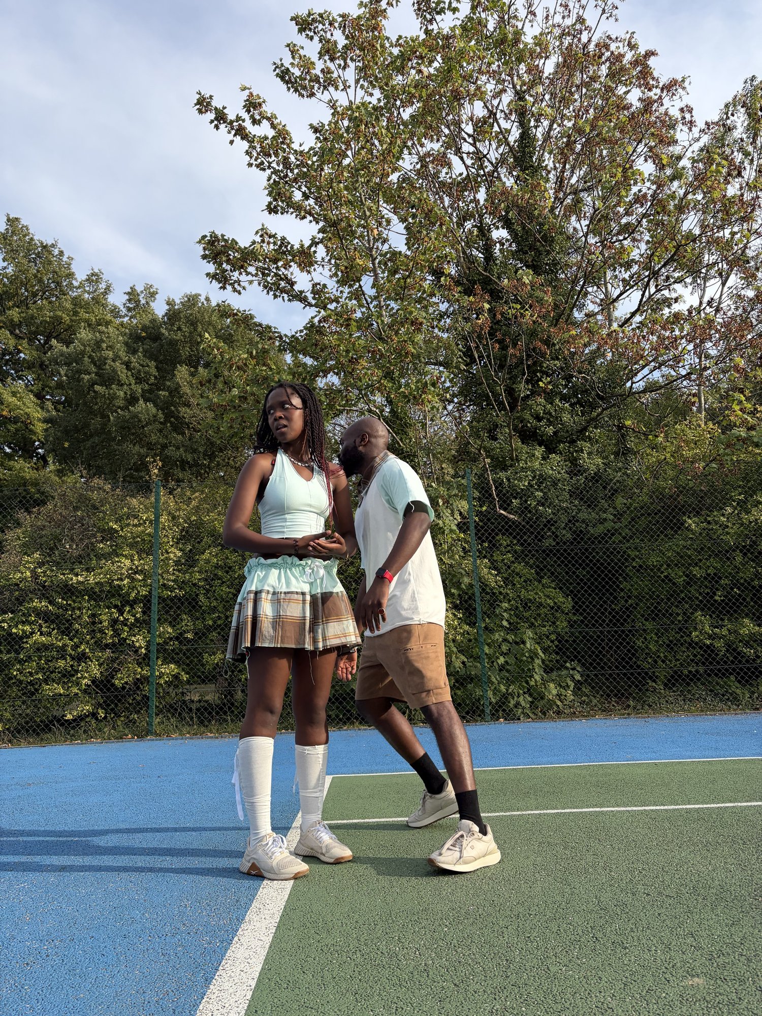 obi and Kah'Nya walking together on the court